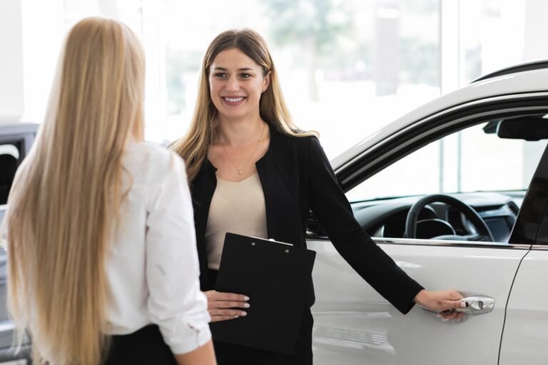 women-discussing-car-showroom